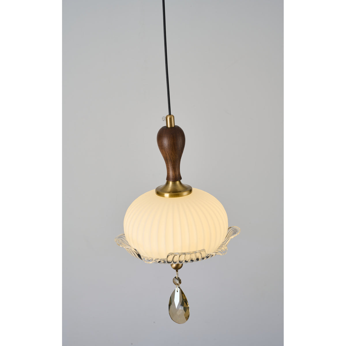 Supplier real detail photograph of Valloren Pendant A walnut neck, ribbed globe and crystal detail lit