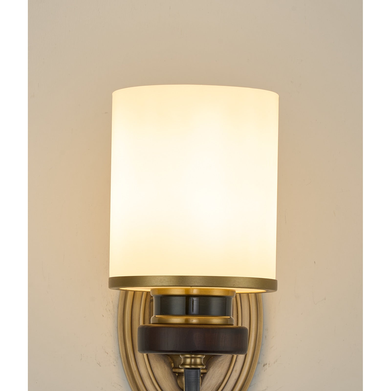 Supplier real detail photograph of the Ashbourne illuminated opal shade and brass-rimmed collar