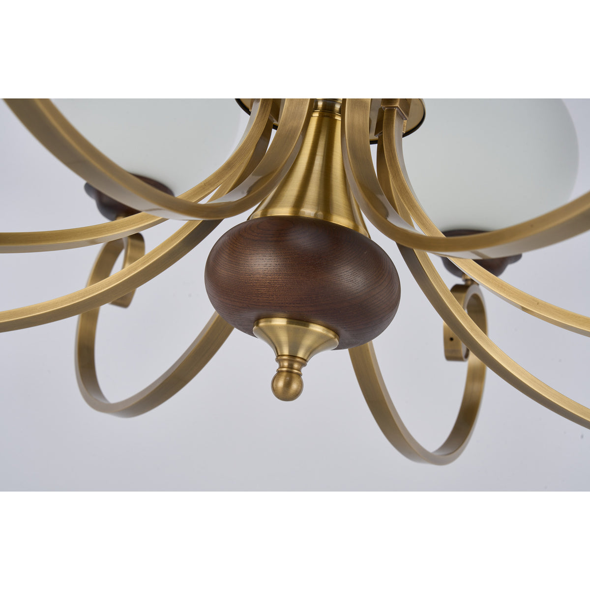 Supplier real detail photograph of the Aurellane deep ash-wood lower finial and antique brass hub