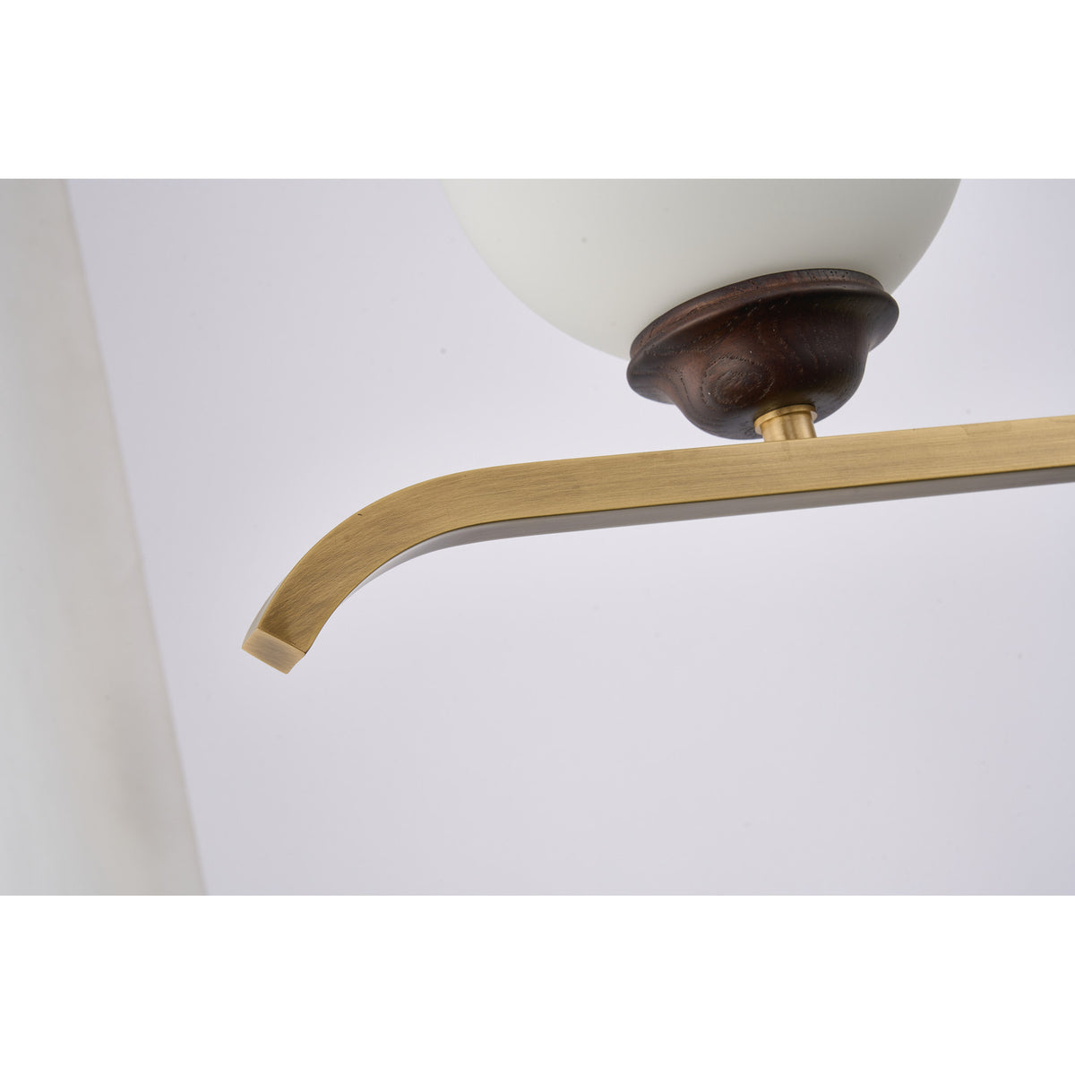 Supplier real detail photograph of the Avelune dark ash-wood cup and upturned copper bar