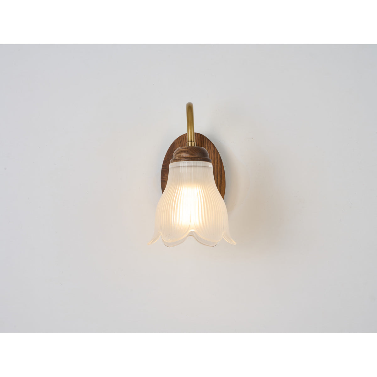Supplier real front product photograph of the ribbed bell glass wall sconce unlit