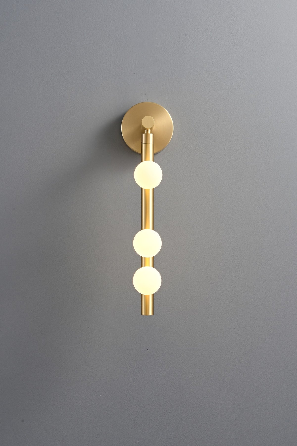 Modern Glass Globe Vertical Wall Sconce - 07 07-real-shot-brass-globe-vertical-wall-sconce-bright