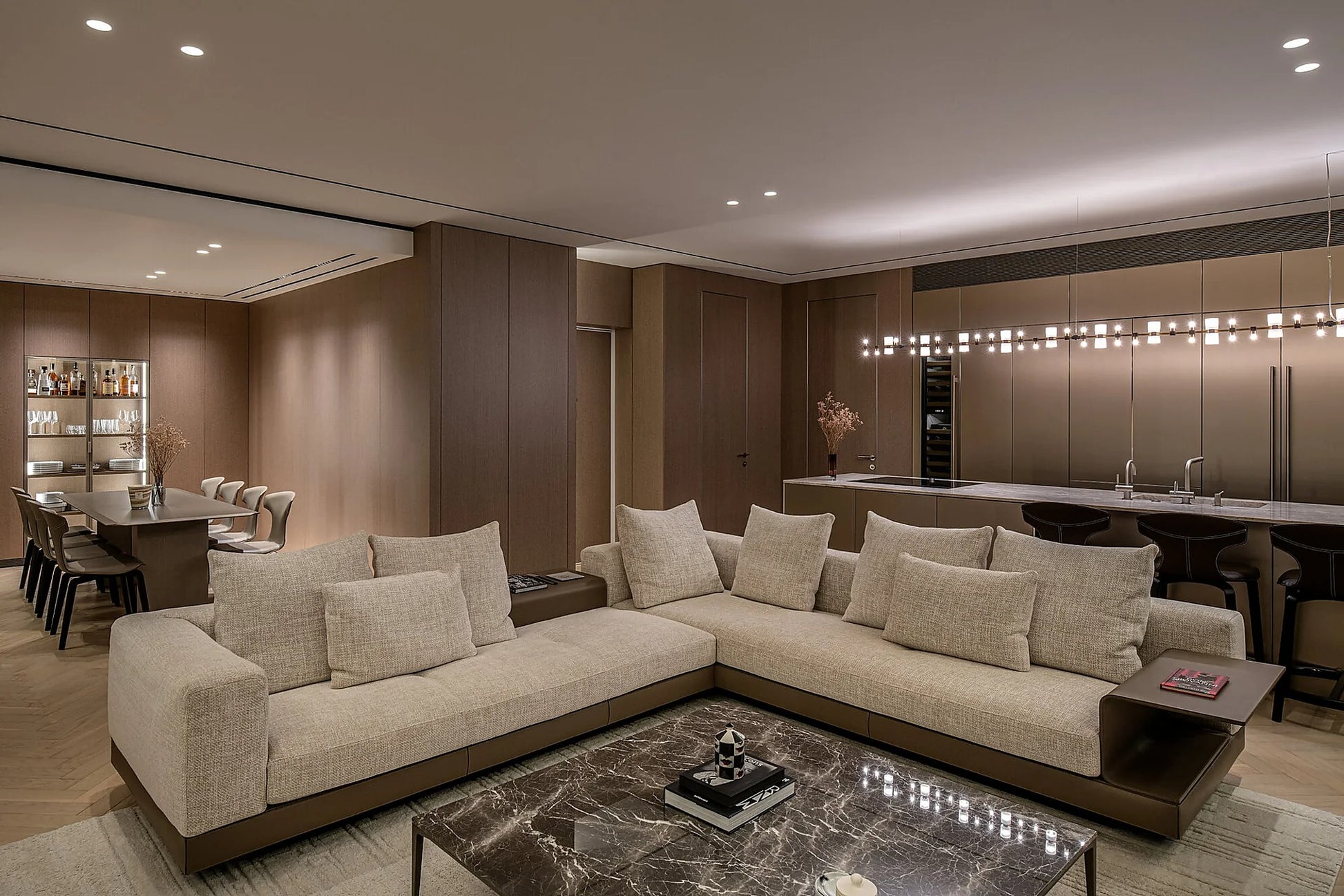 Royal linear pendant installed across a large contemporary living room