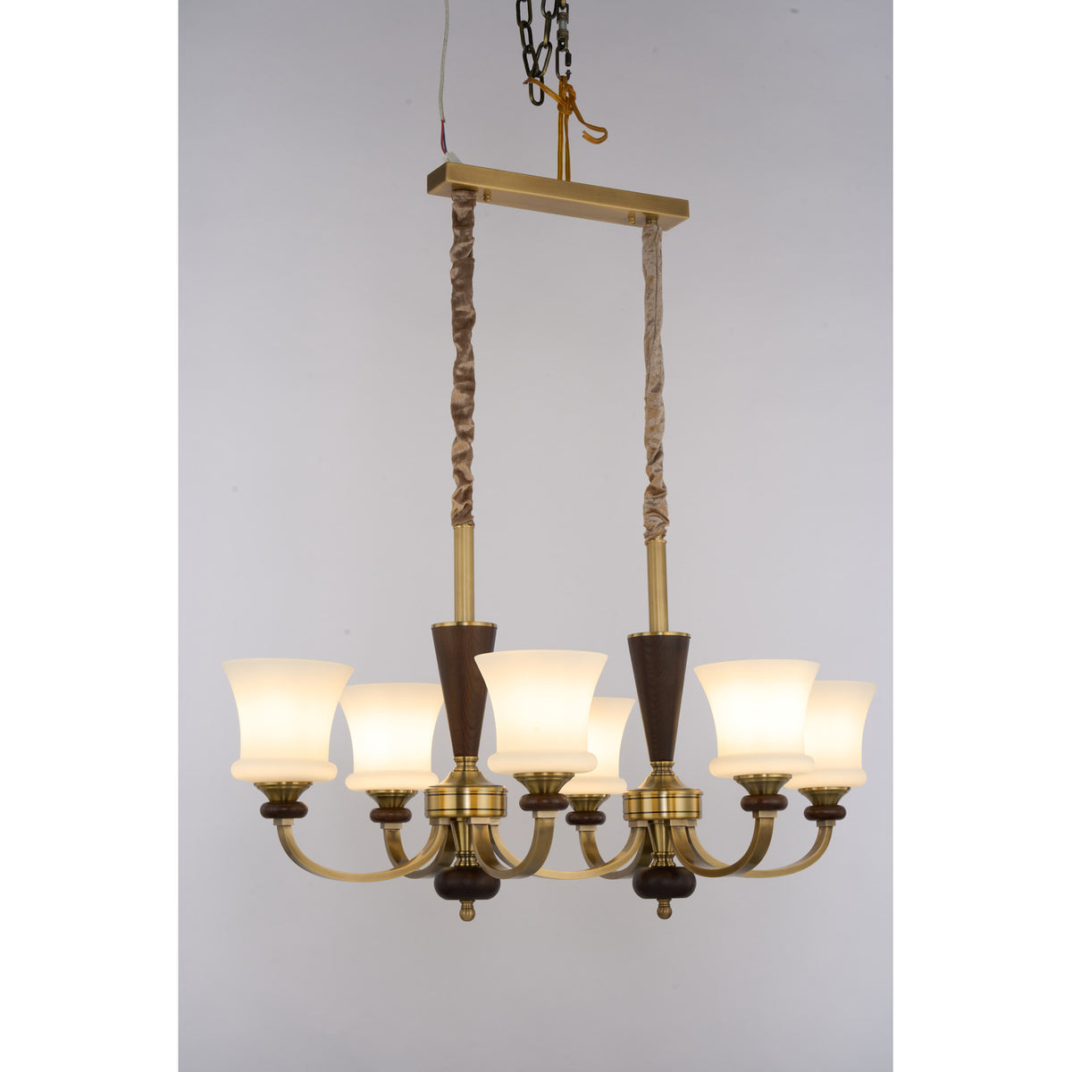 Caldrienne six-light linear chandelier wide lit real product view