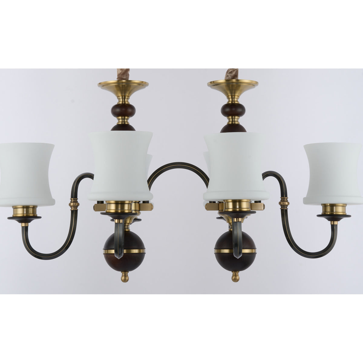 Supplier real detail crop of the Ebonelle twin deep ash-wood finials and brass hubs