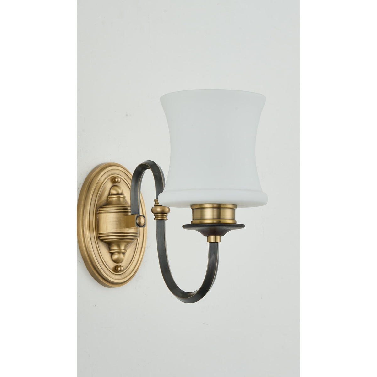 Supplier real detail crop of the Ebonelle one-light blackened arm and gold edging