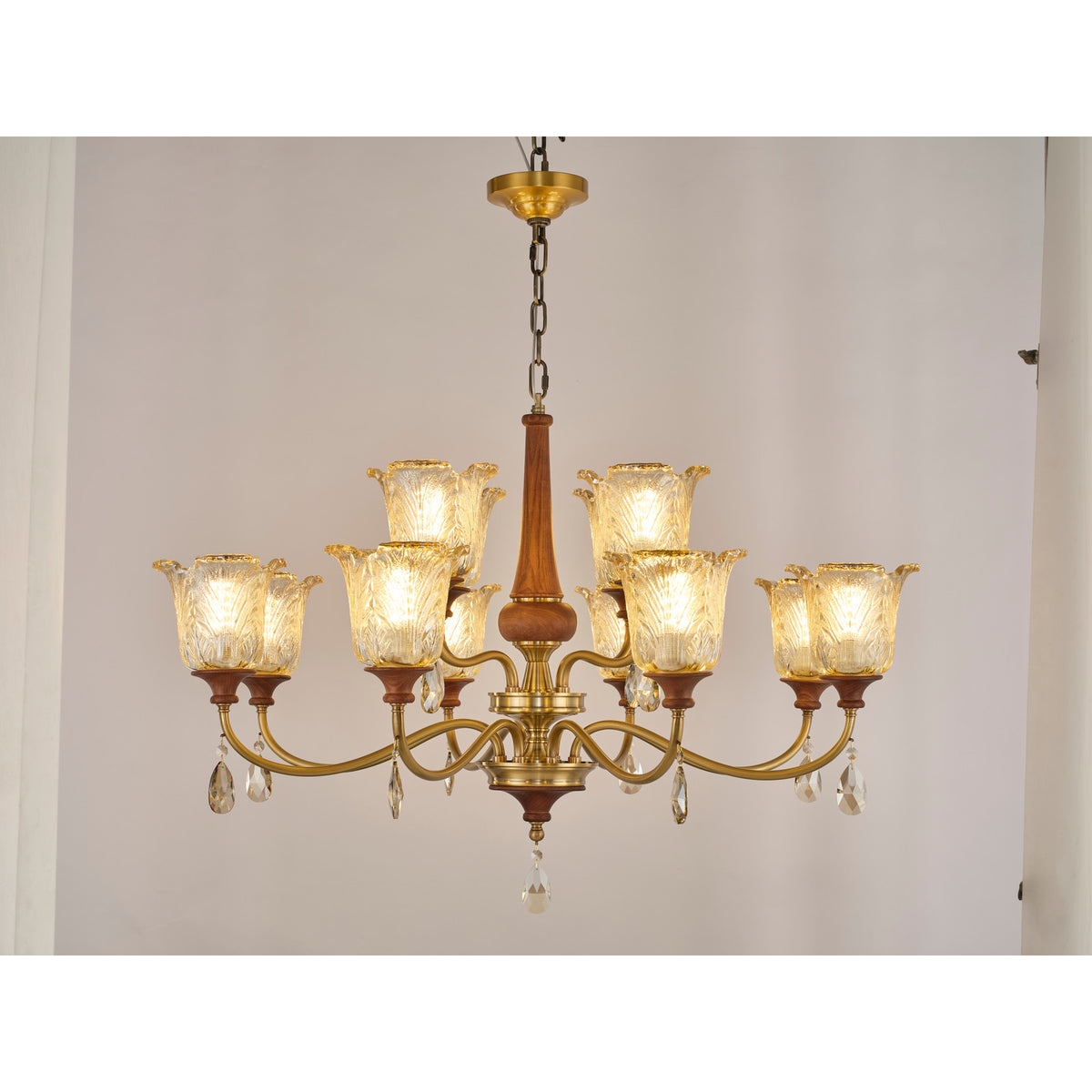 Real product photograph of the Aurelia fifteen-light two-tier chandelier illuminated