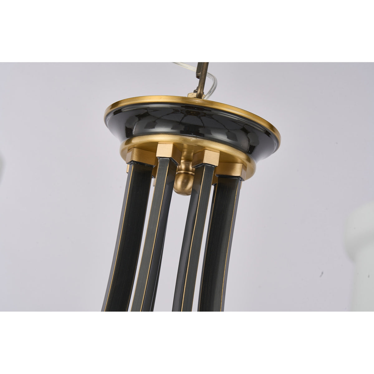Supplier real detail photograph of the Montclair blackened upper frame and antique-brass canopy plate