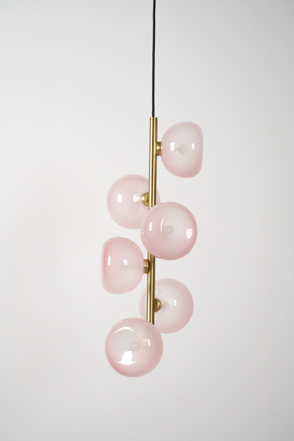 Blush glass six-light vertical pendant in Natural Brass, unlit product view