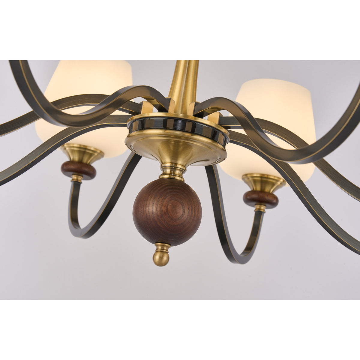 Supplier real detail photograph of the Wetherby dark wood lower ball, antique-brass hub and curved arms