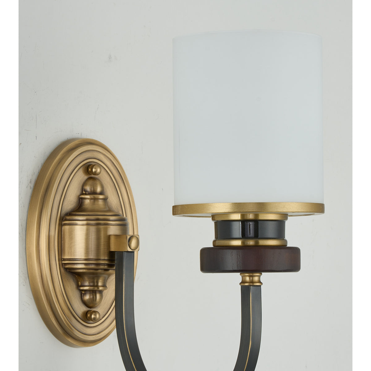 Supplier real detail photograph of the Ashbourne unlit sconce backplate, wood collar and blackened arm