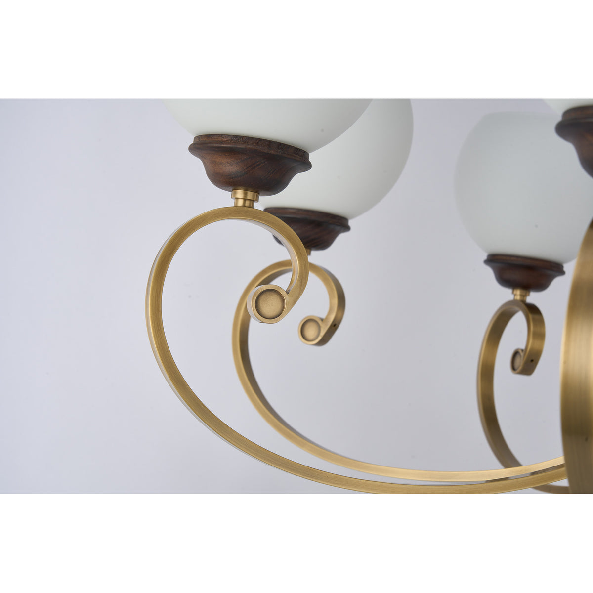 Supplier real detail photograph of the Aurellane inward-scroll antique brass arm