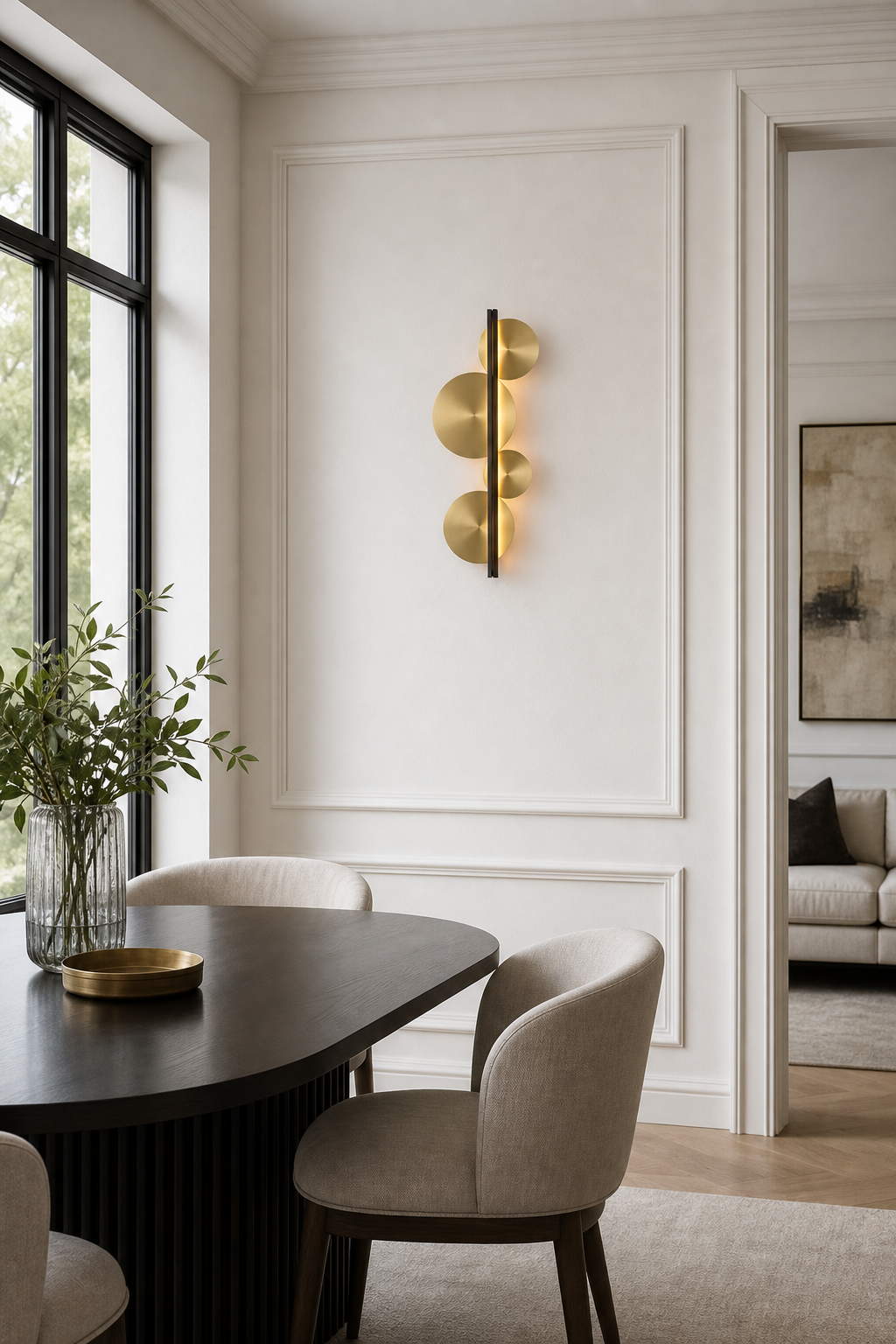 Brass Disc LED Wall Sconce installed on a dining lounge accent wall