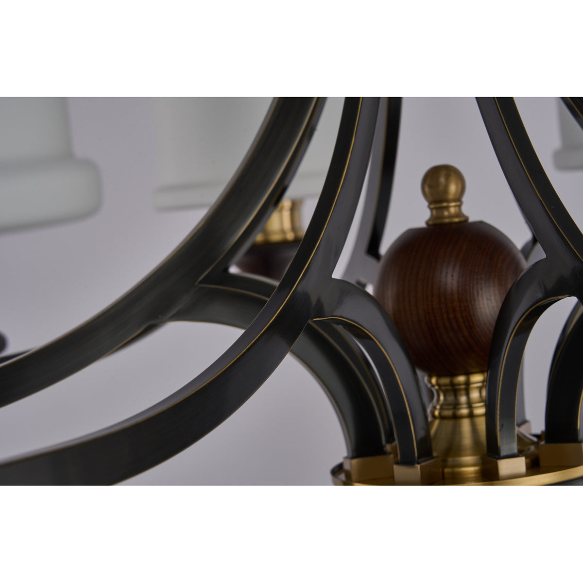 Supplier real detail photograph of the Montclair dark ash-wood center accent and inward-sweeping black frame