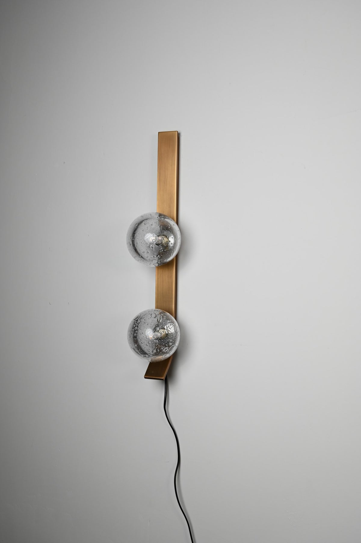 Modern Glass Globe Wall Sconce in Antique Brass - 09 09-real-shot-glass-globe-wall-sconce-finish-detail