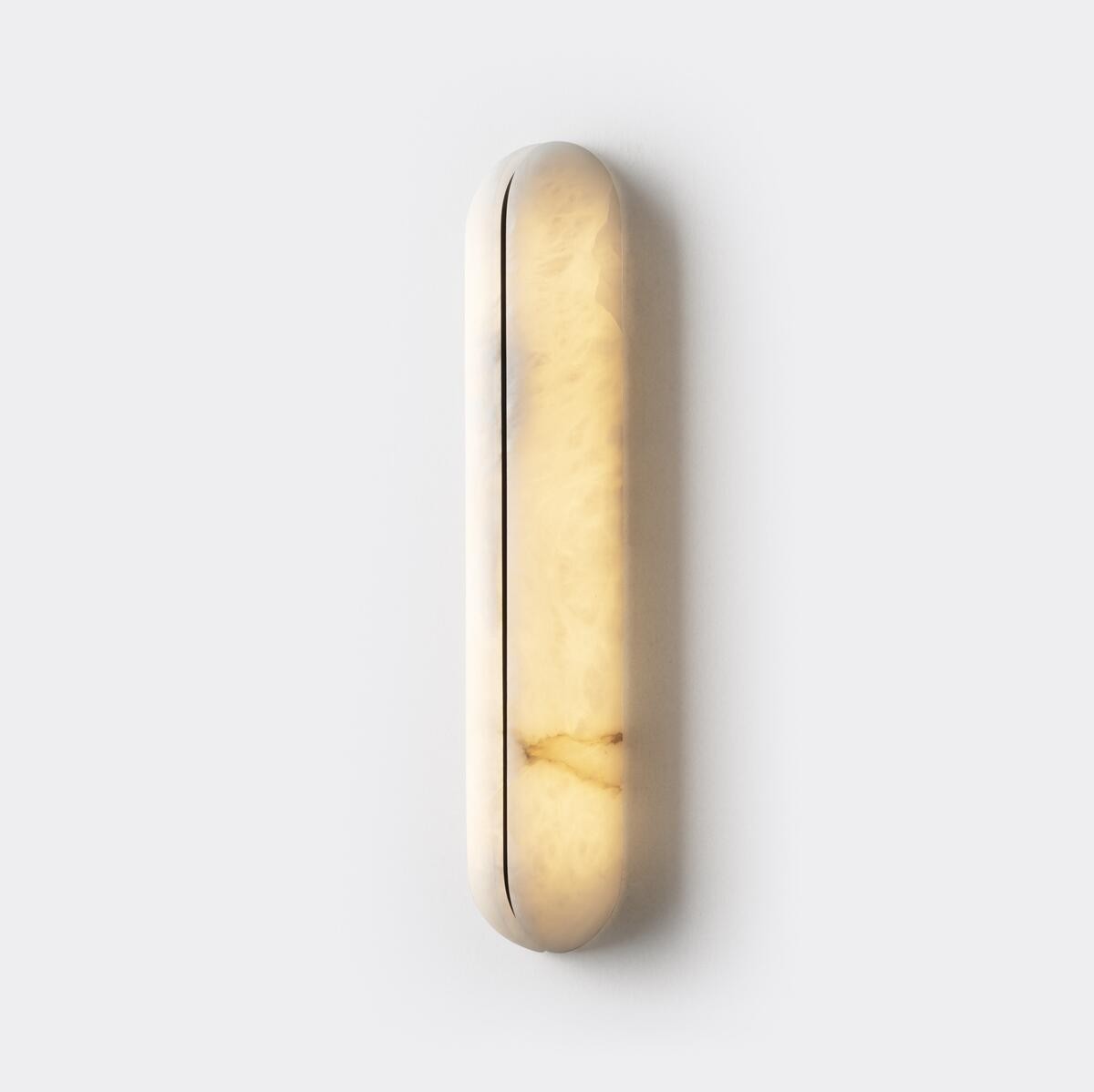 Real small alabaster capsule wall sconce angled view