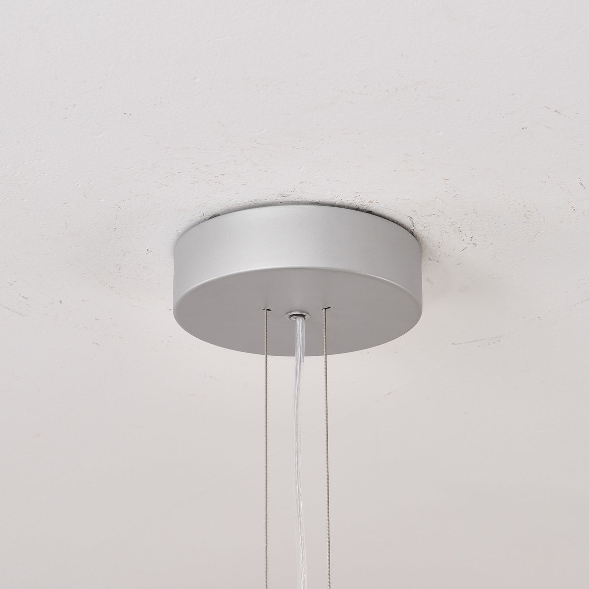 Close supplier photograph of the Apollo chandelier ceiling canopy and suspension cables