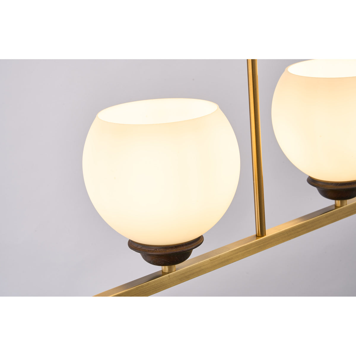 Supplier real detail photograph of the Avelune opal globe and dark ash-wood cup illuminated