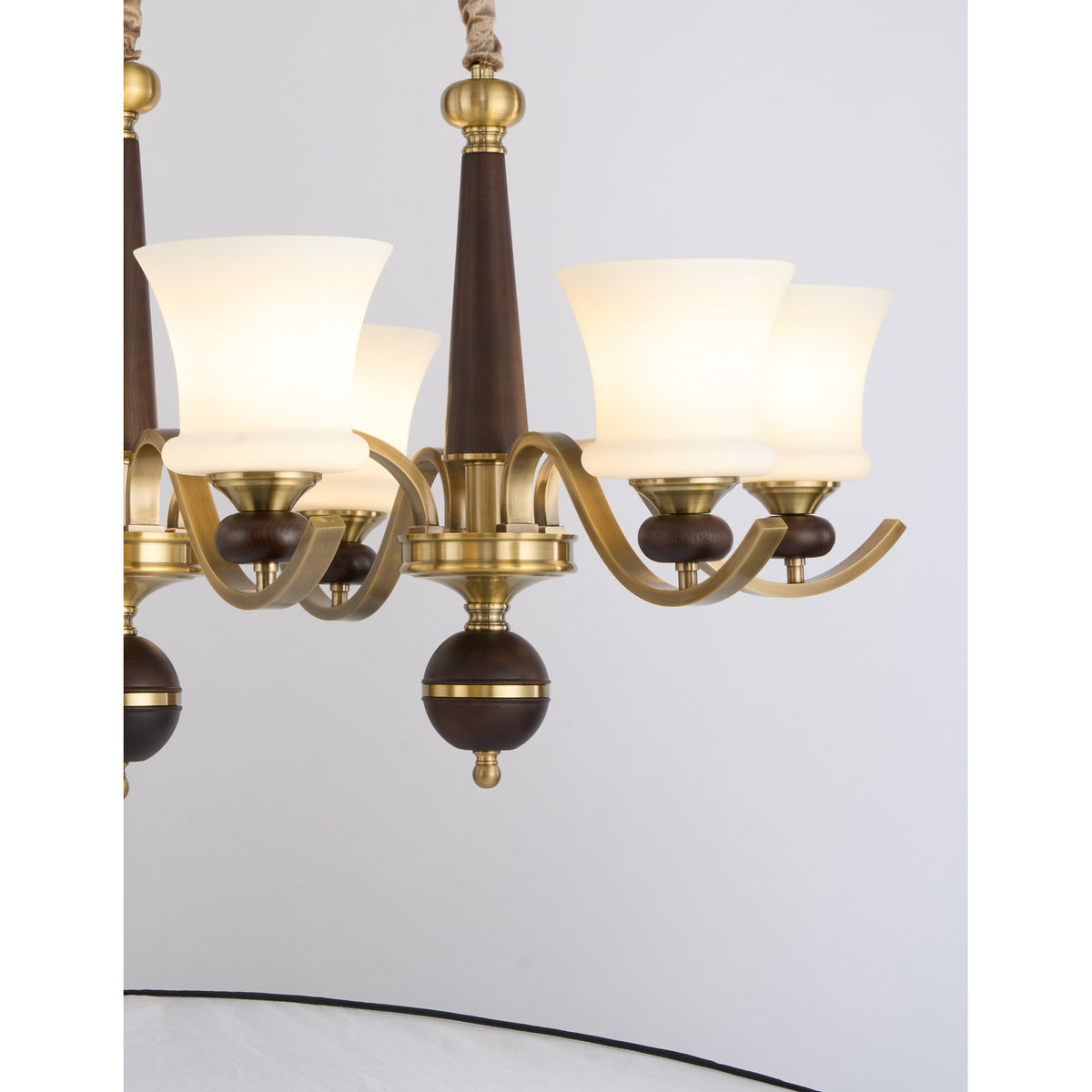 Supplier real detail crop of the Brontelle antique brass arm and opal glass assembly