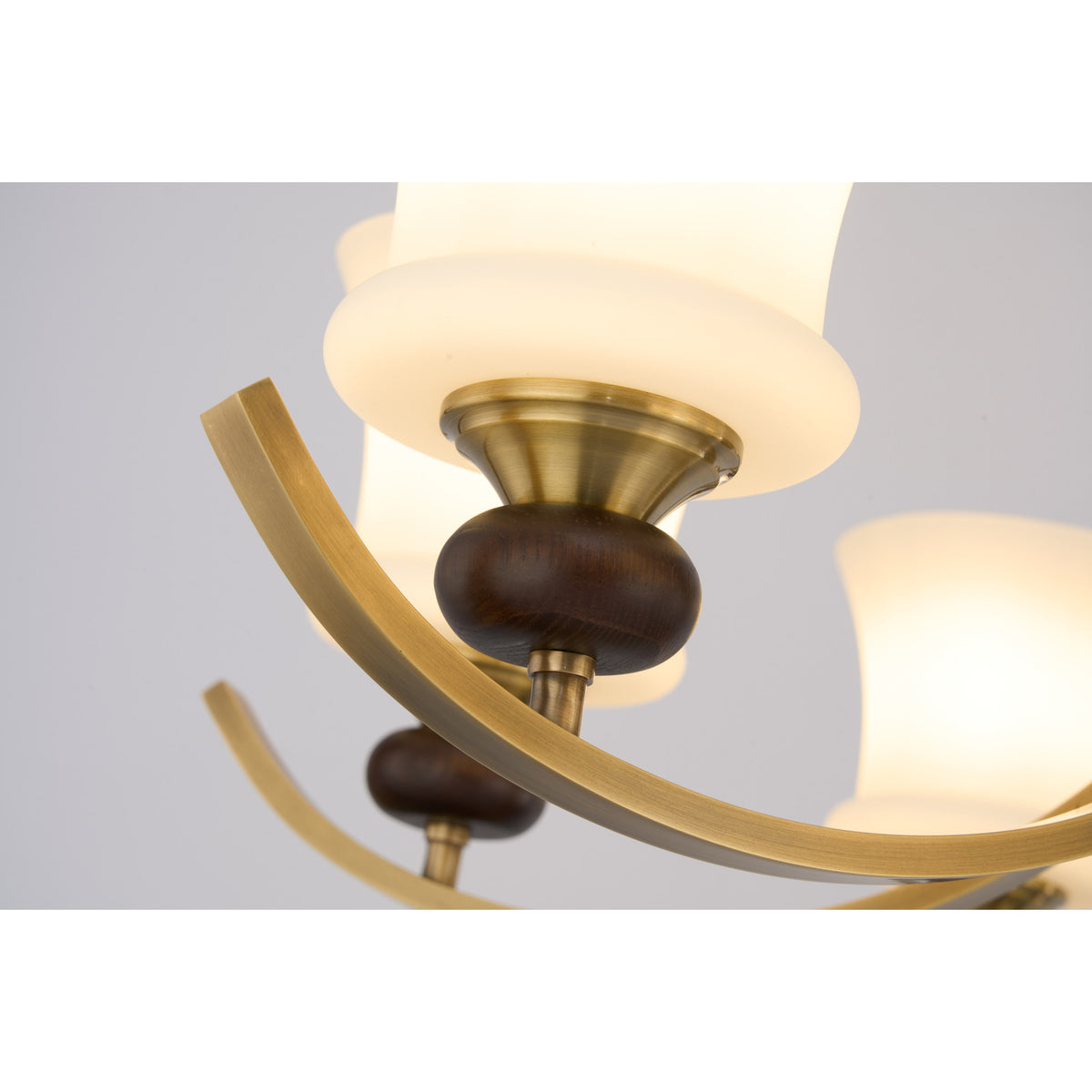 Supplier real close-up of the Brontelle opal shade, dark ash-wood collar and antique brass arm