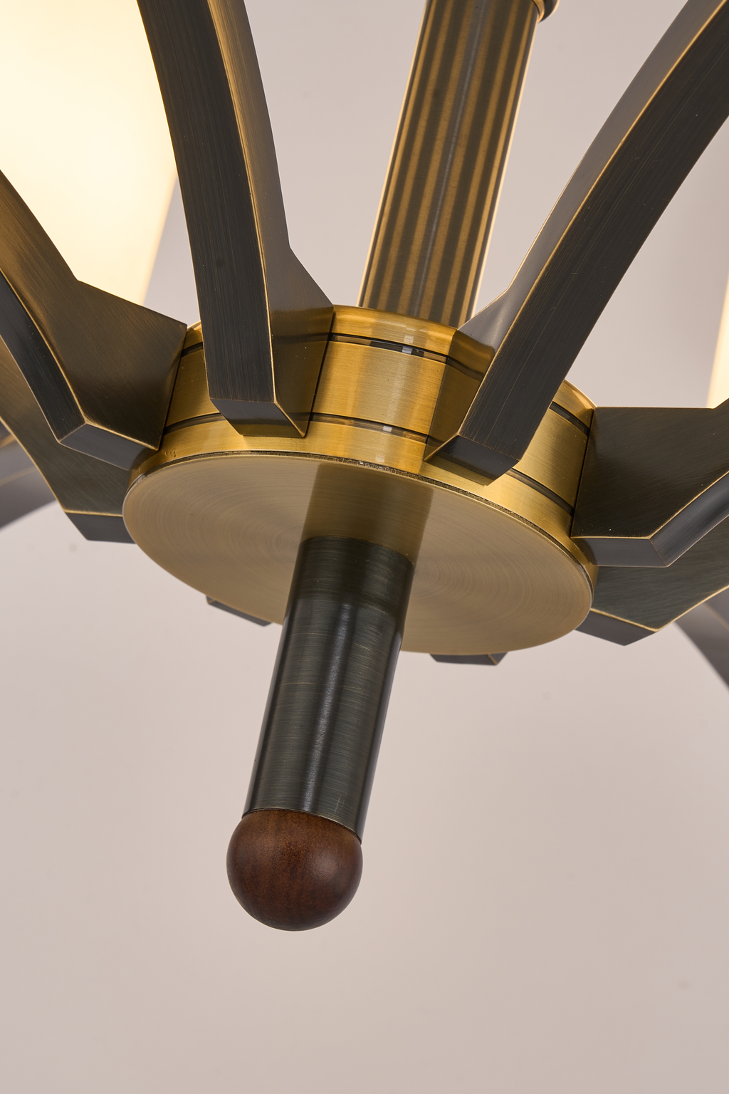 Cylmere blackened angular arm and antique-gold center hub detail