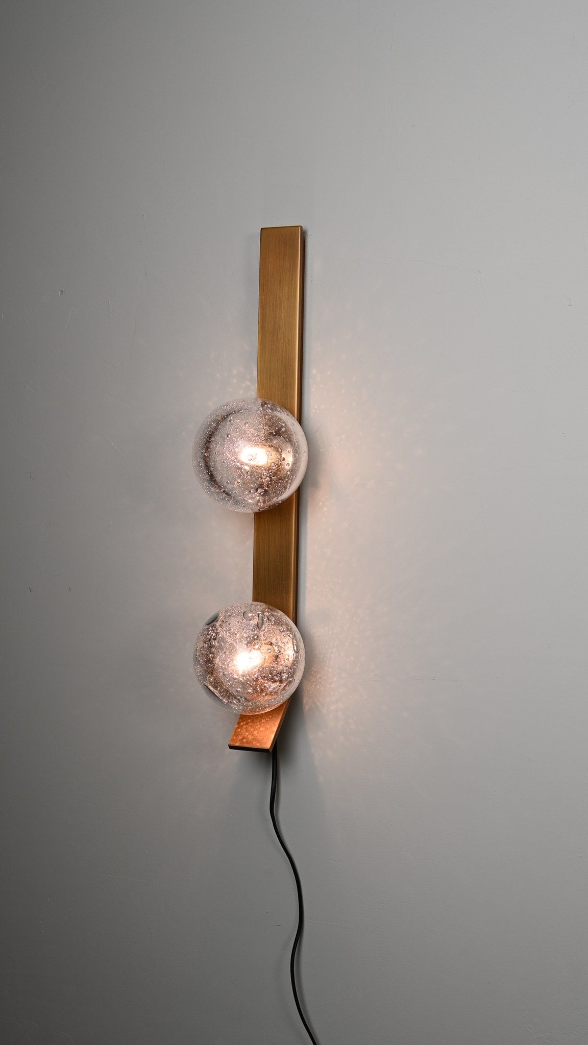 Modern Glass Globe Wall Sconce in Antique Brass - 10 10-real-shot-glass-globe-wall-sconce-room-view