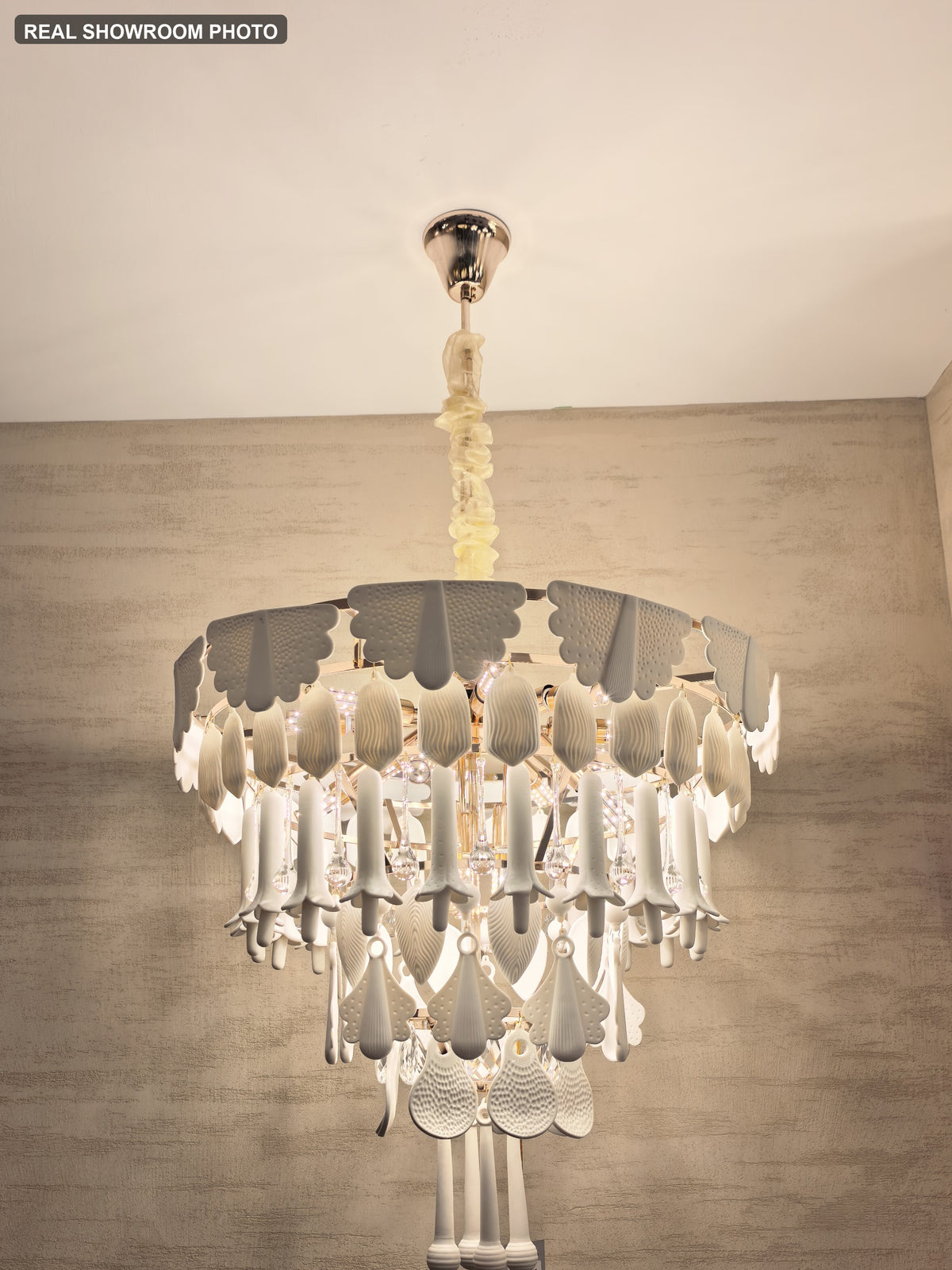 Real showroom photo — Muguetelle ivory ceramic chandelier full installed view