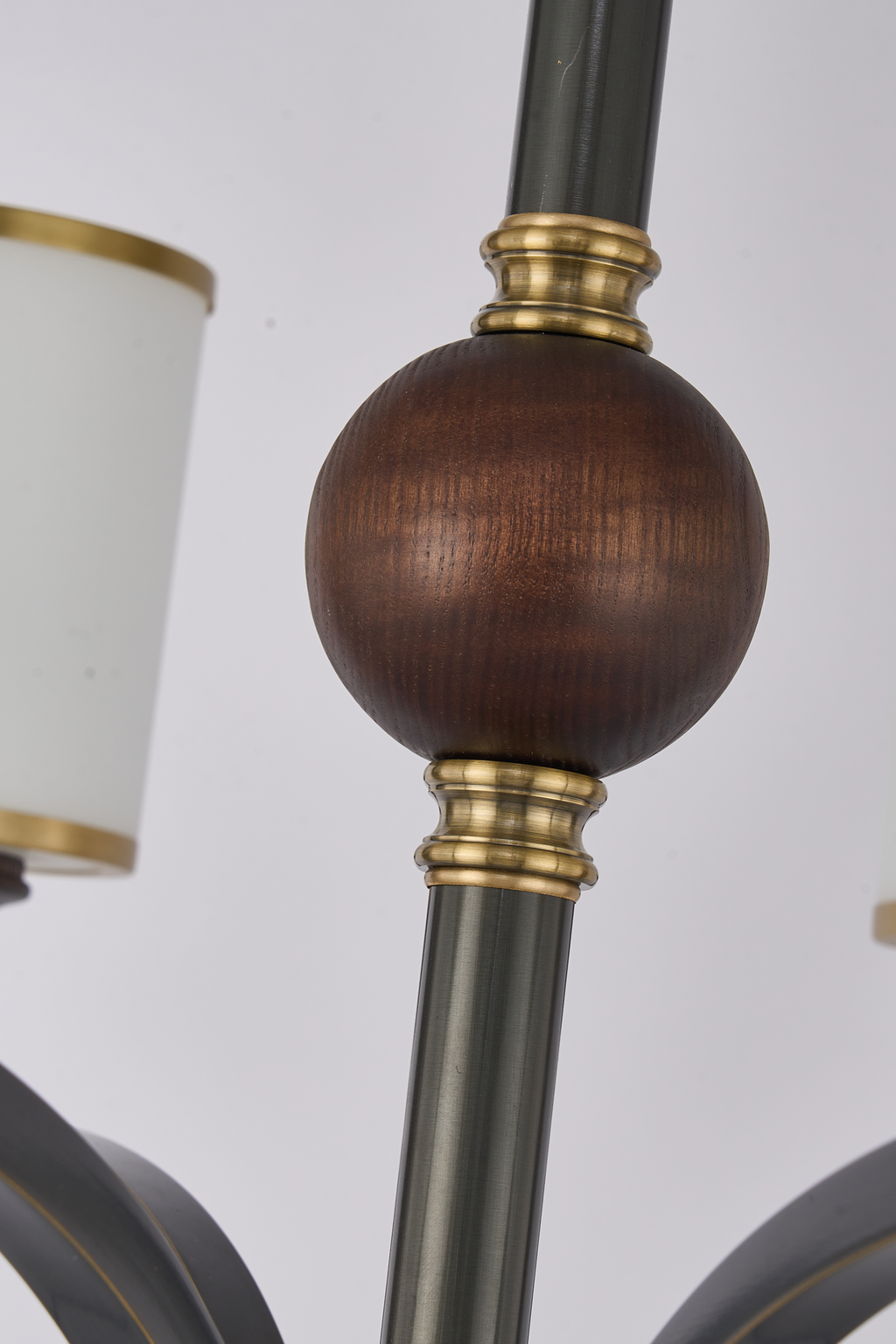 Cylmere dark ash-wood center sphere and antique-gold stem detail