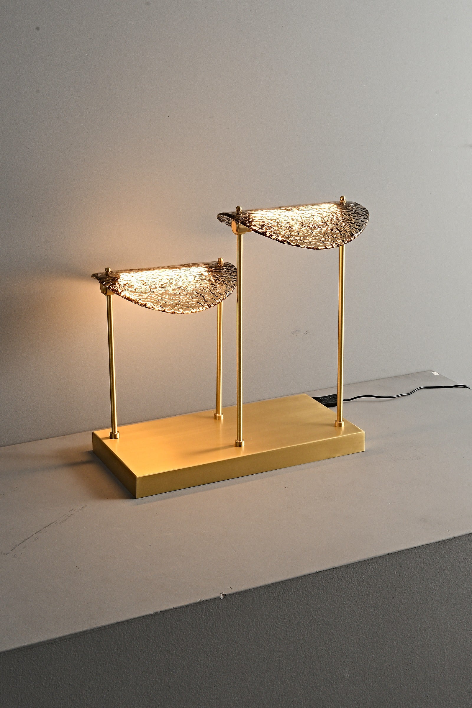 Modern Smoked Glass Brass Table and Floor Lamp - 22 11-real-table-lamp-lit-angle