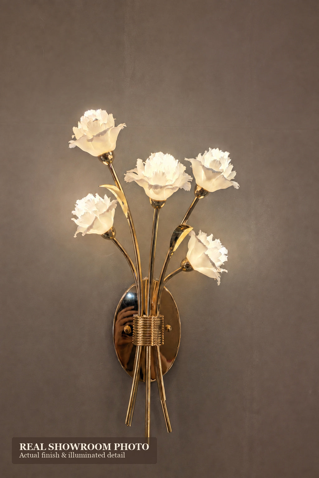 Sylverelle wall sconce – phone-shot showroom view of compact floral wall sconce
