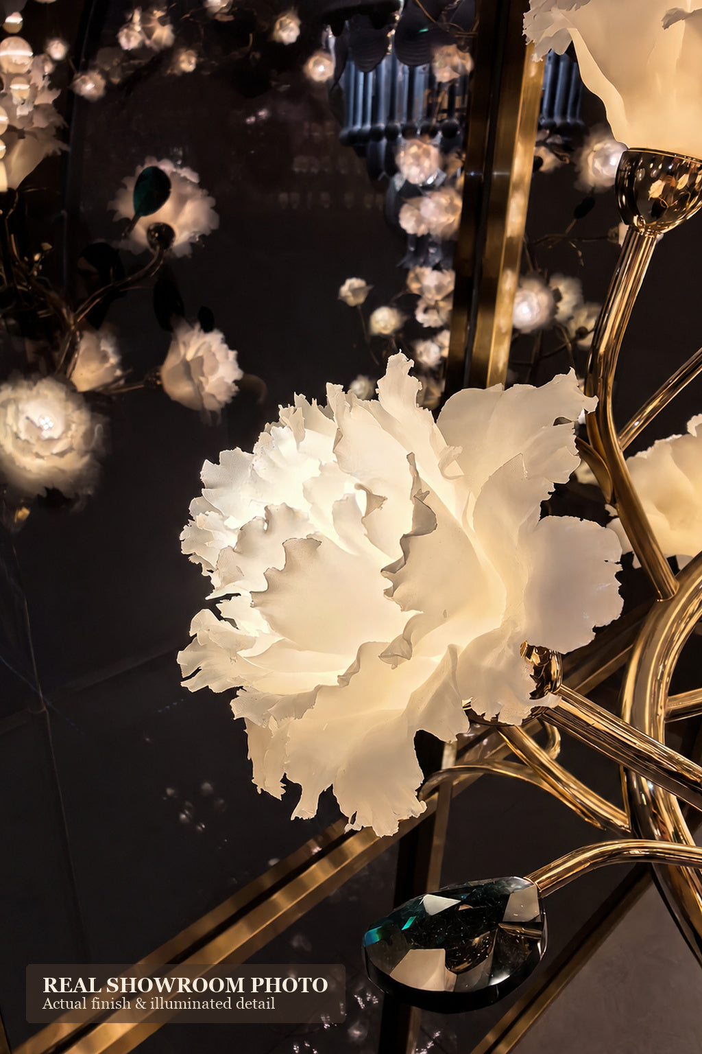 Sylverelle wall sconce – close showroom view of green faceted accent beside white floral shade