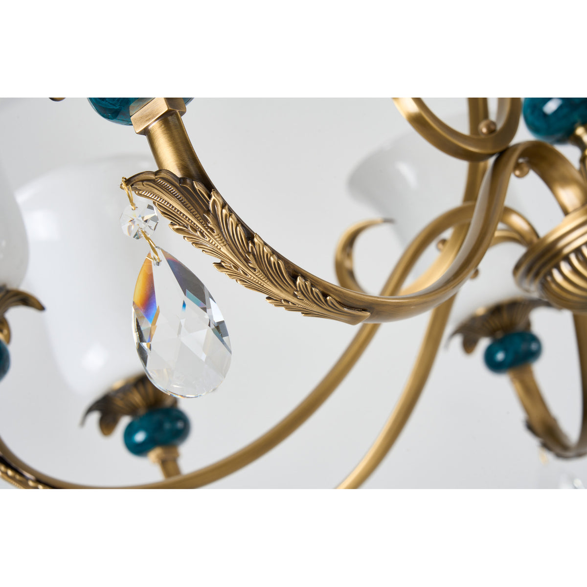 Real Marcelline chandelier detail showing the crystal drop and sculpted arm