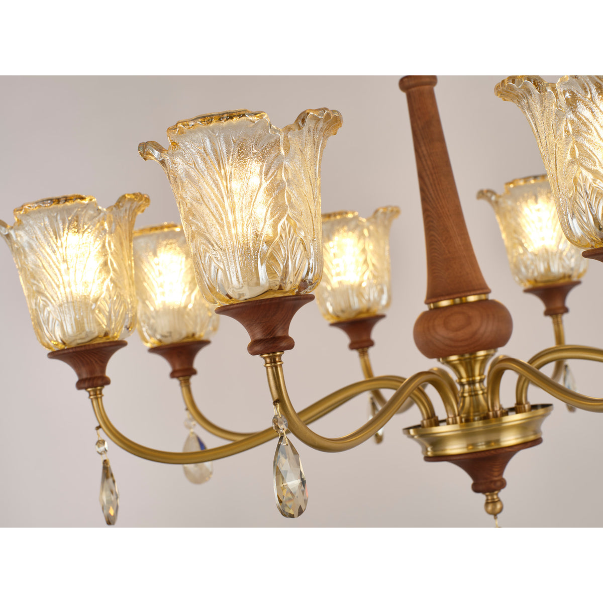 Real Aurelia chandelier detail showing the sculpted floral glass shade