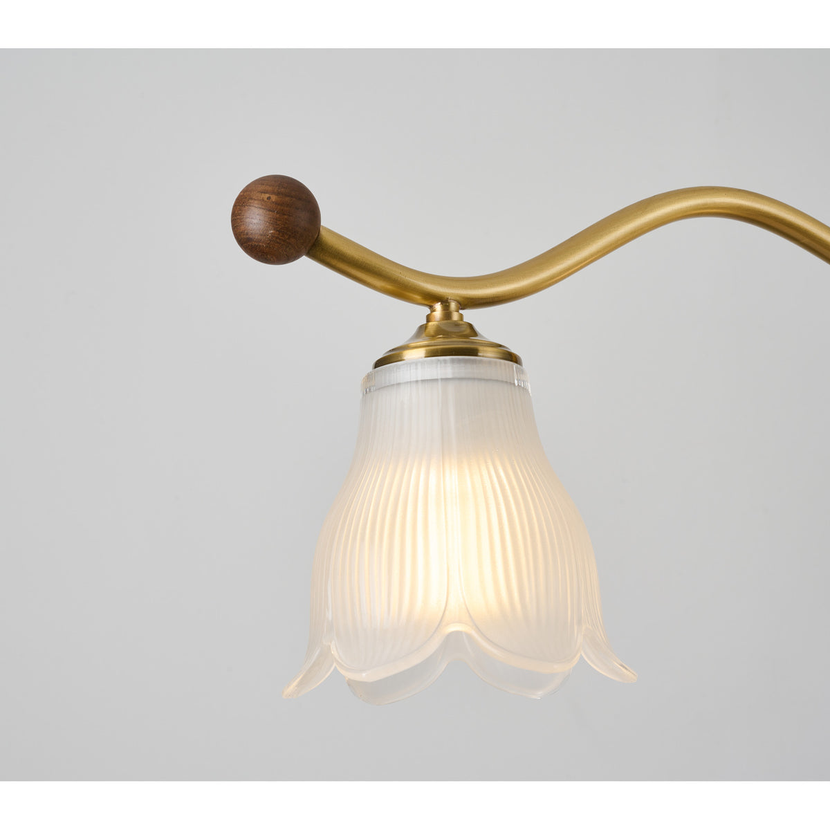 Supplier real linear chandelier detail showing a walnut-finished end cap and ribbed shade
