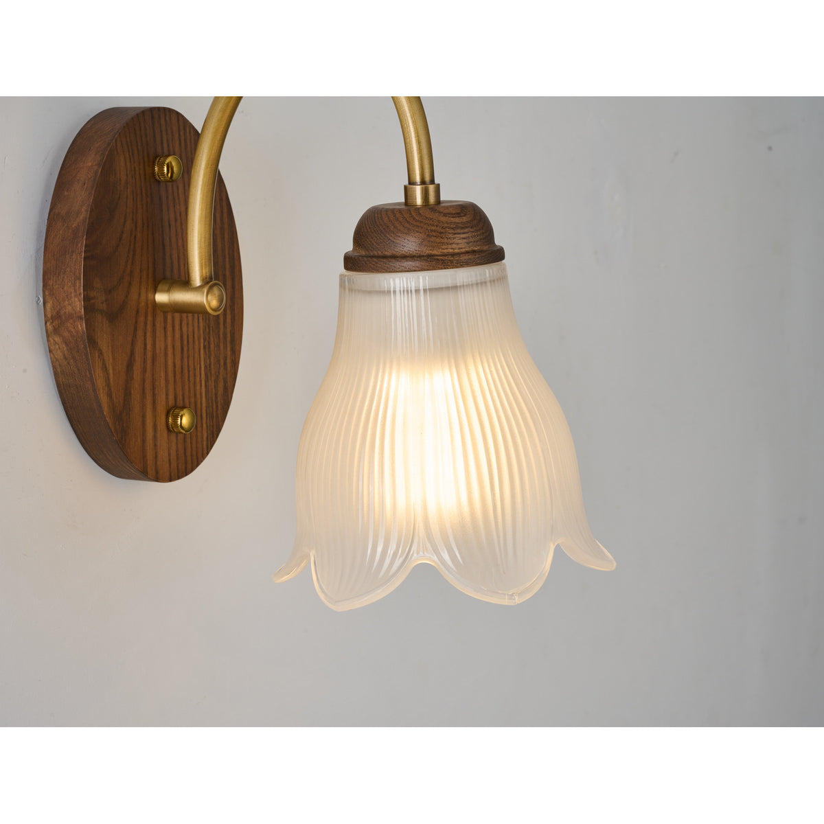 Supplier real wall sconce detail showing the vertically ribbed bell glass shade