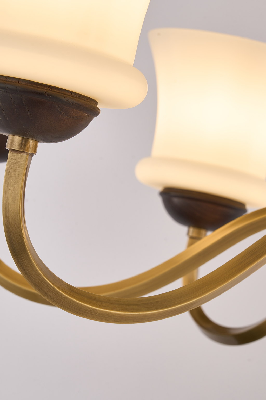 Halveraine curved natural-copper-finished arms, dark ash-wood shade cups and flared milk-glass detail