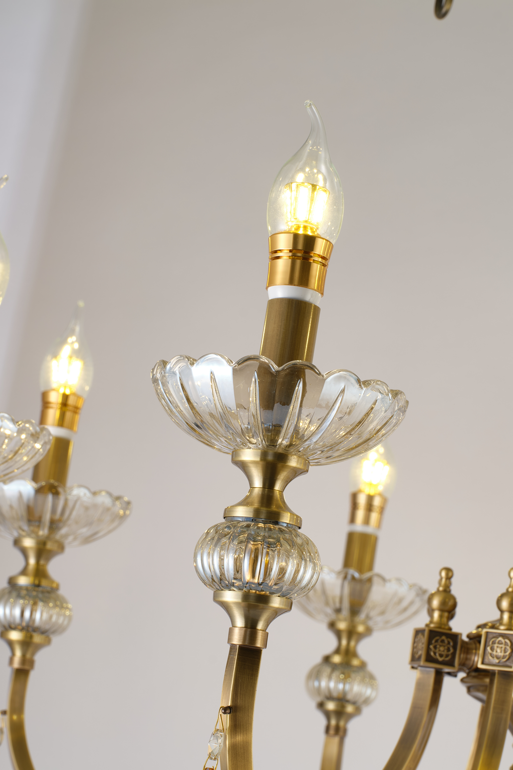 Lucerayne fluted clear-glass candle cups and antique-bronze lamp holders detail
