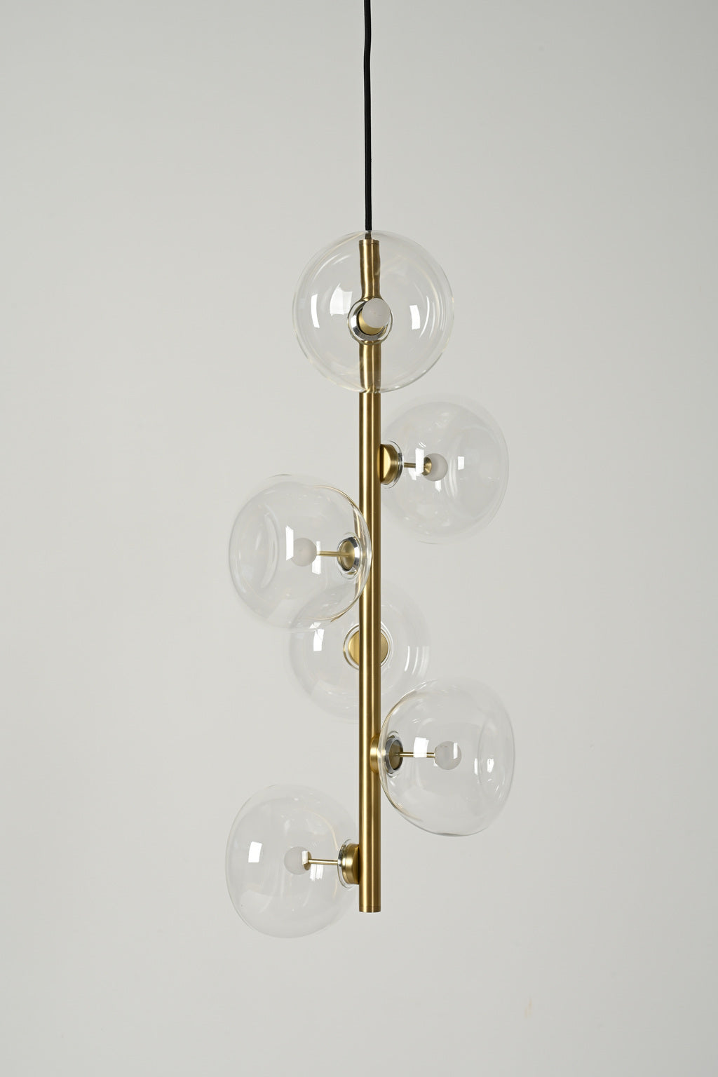 Clear glass six-light vertical pendant in Natural Brass, unlit product view