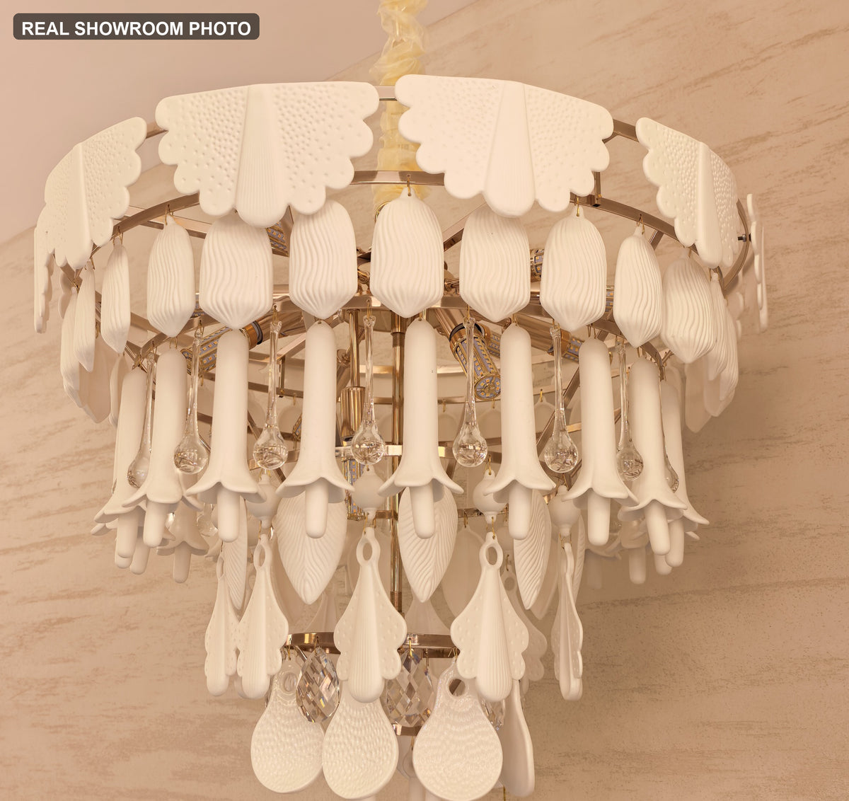 Real showroom photo — Muguetelle handmade ivory ceramic and clear crystal details