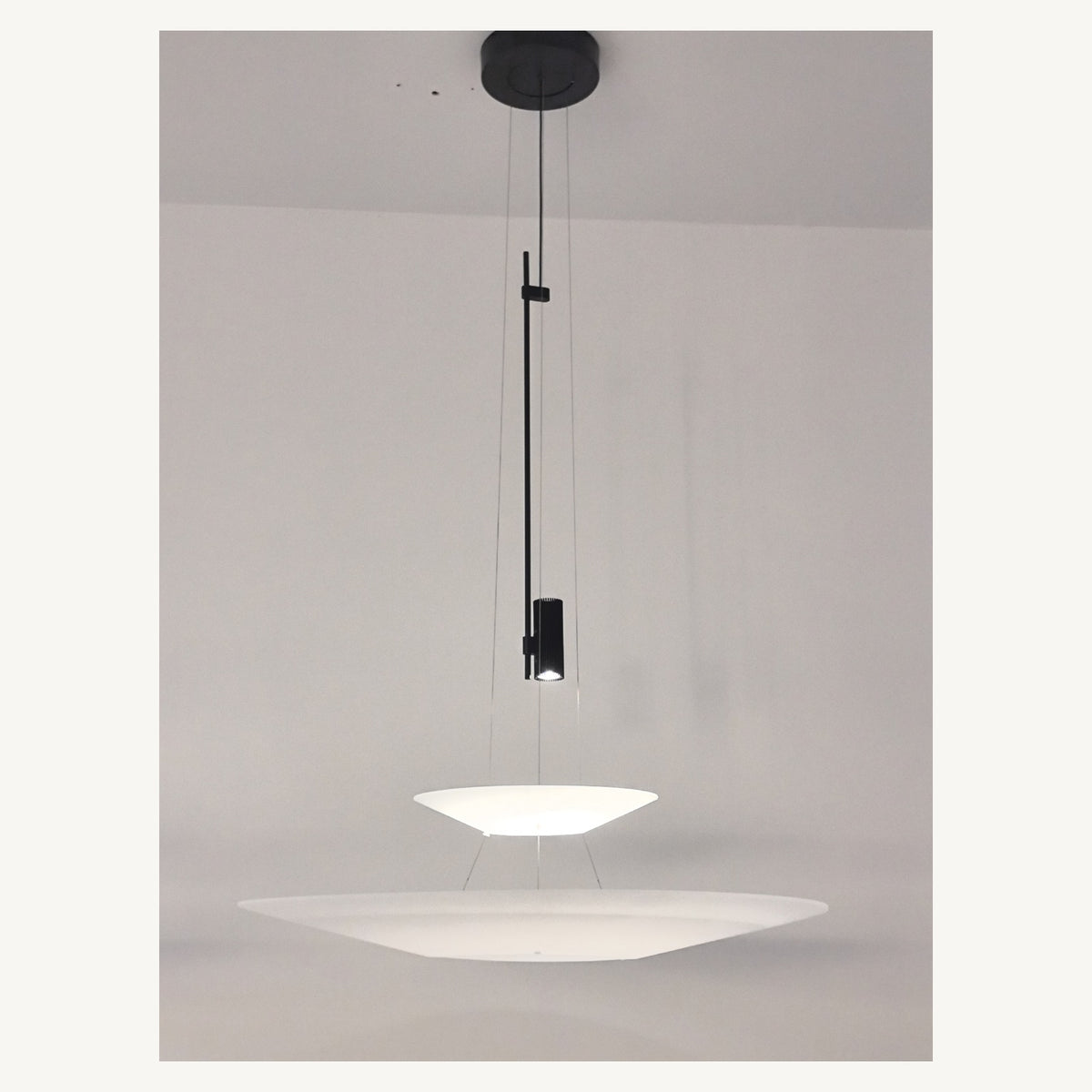 Supplier real photograph of the complete two-tier layered acrylic disc pendant with canopy
