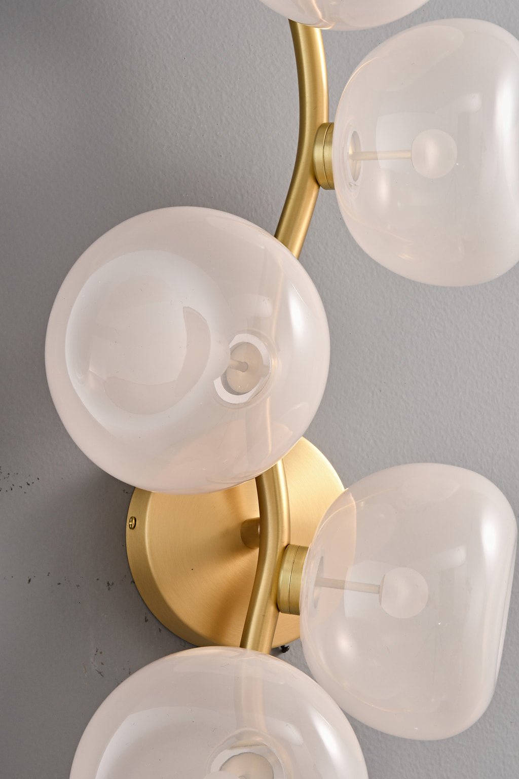 Modern Glass Globe Branch Wall Sconce in Natural Brass - 6 shades pink glass and brass detail, lights off