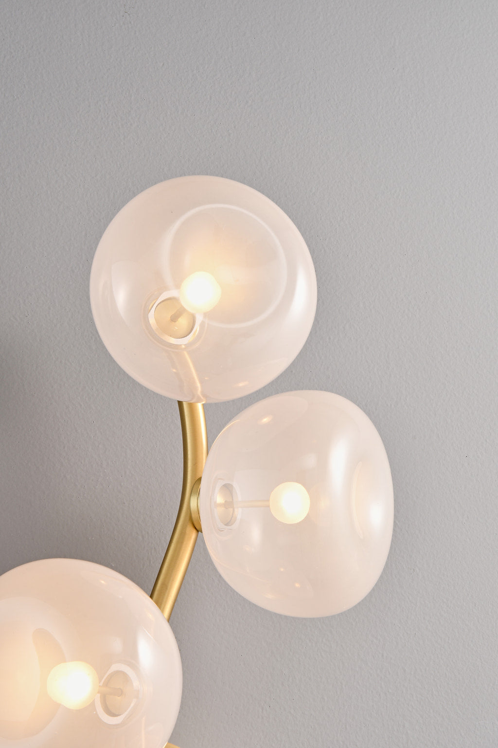 Modern Glass Globe Branch Wall Sconce in Natural Brass - 6 shades pink glass detail, lights on