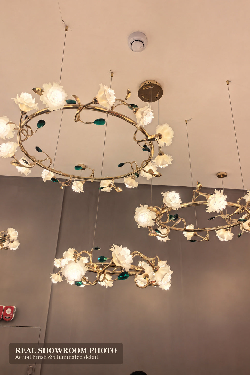 Sylverelle chandelier – wide phone-shot showroom view of floral ring chandeliers