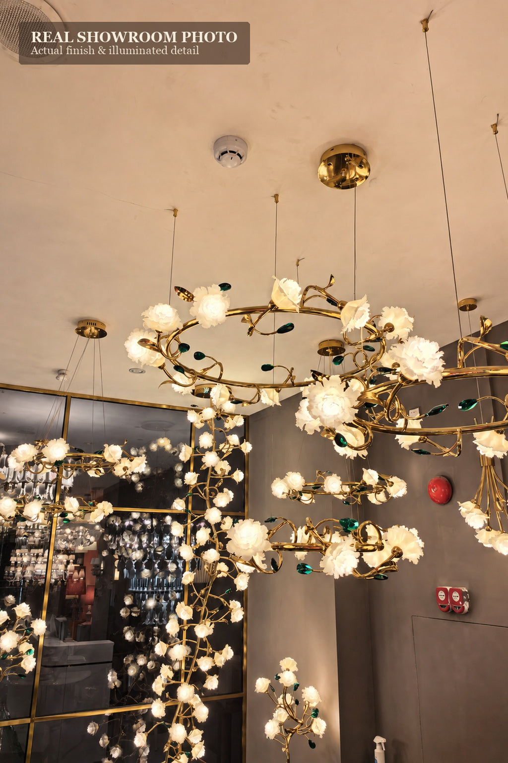 Sylverelle chandelier – phone-shot showroom view of coordinated floral lighting series
