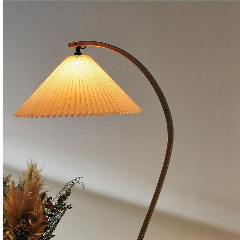 Sculptural Wood Floor Lamp — real illuminated pleated-shade detail