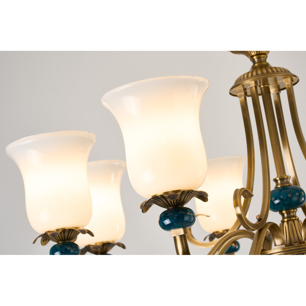 Real Marcelline chandelier detail showing milk glass and teal decorative glass