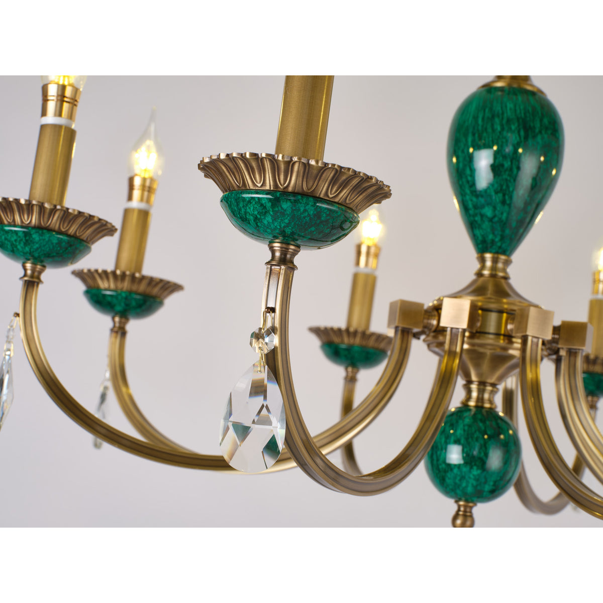 Real Valeria chandelier detail showing a sculpted arm and bobeche