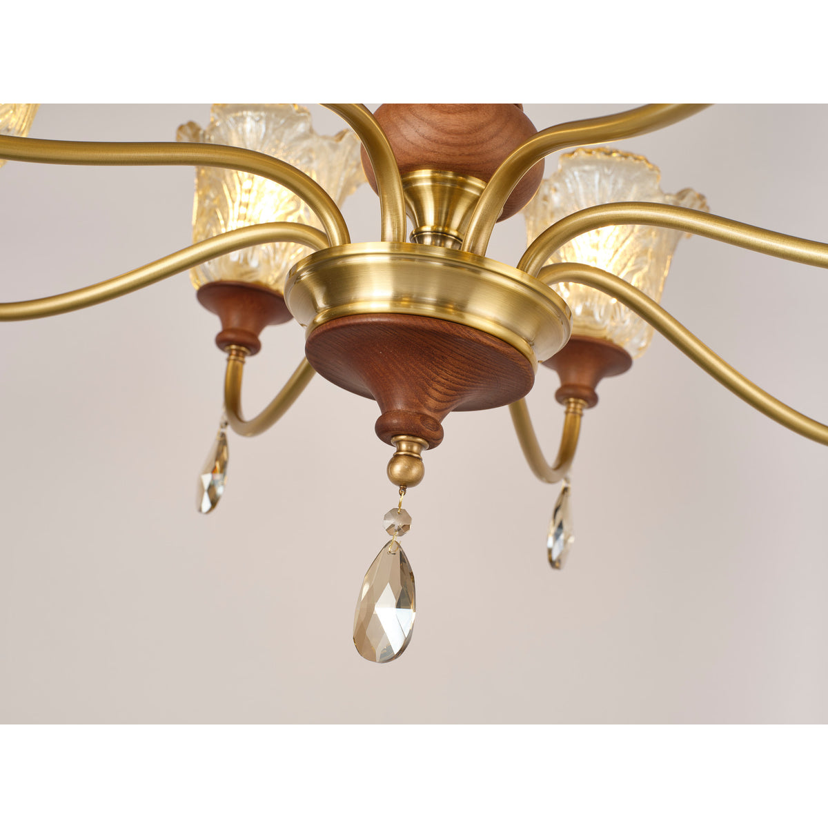 Real Aurelia chandelier detail showing the antique brass hub and central crystal