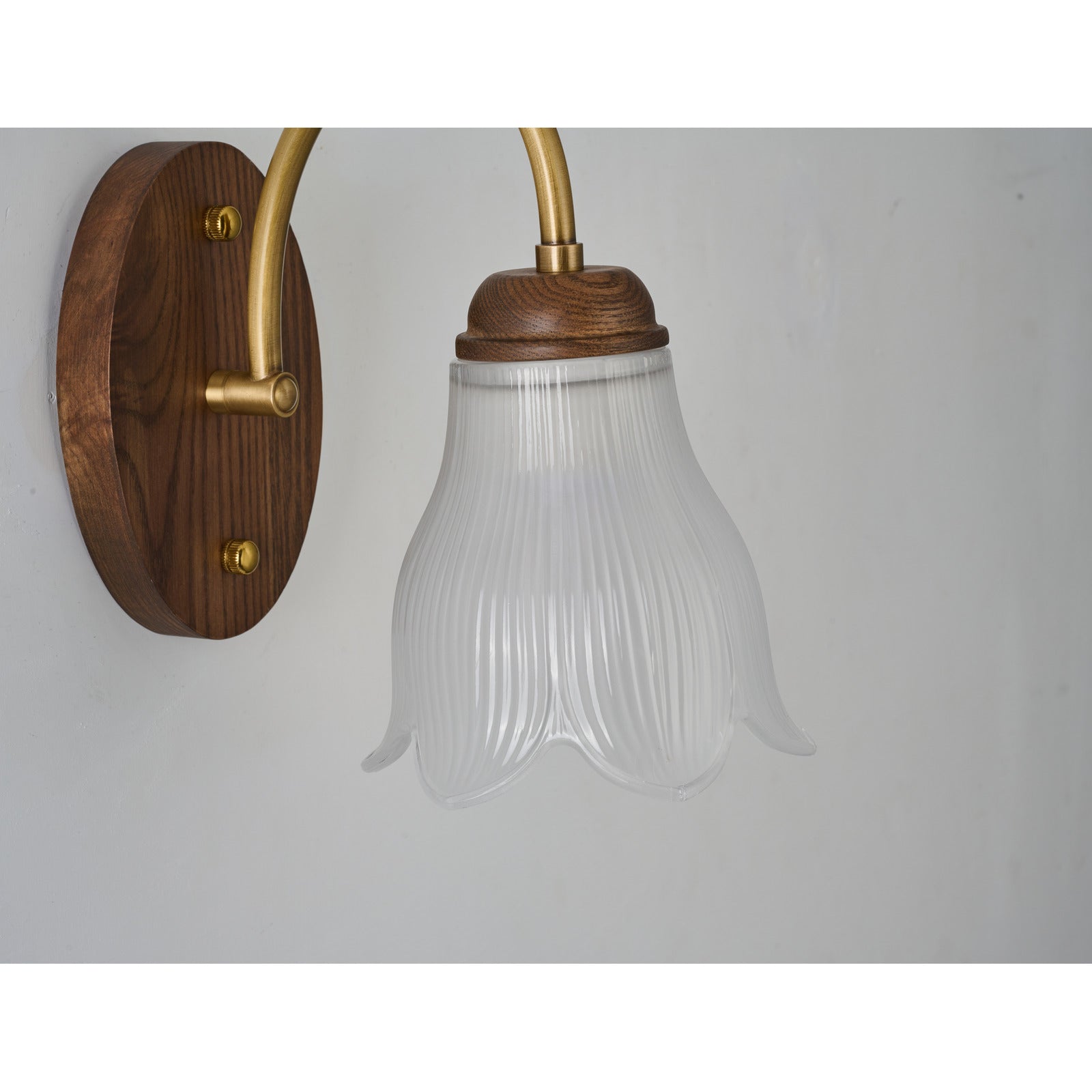 Supplier real wall sconce detail showing the oval walnut-finished ash-wood backplate