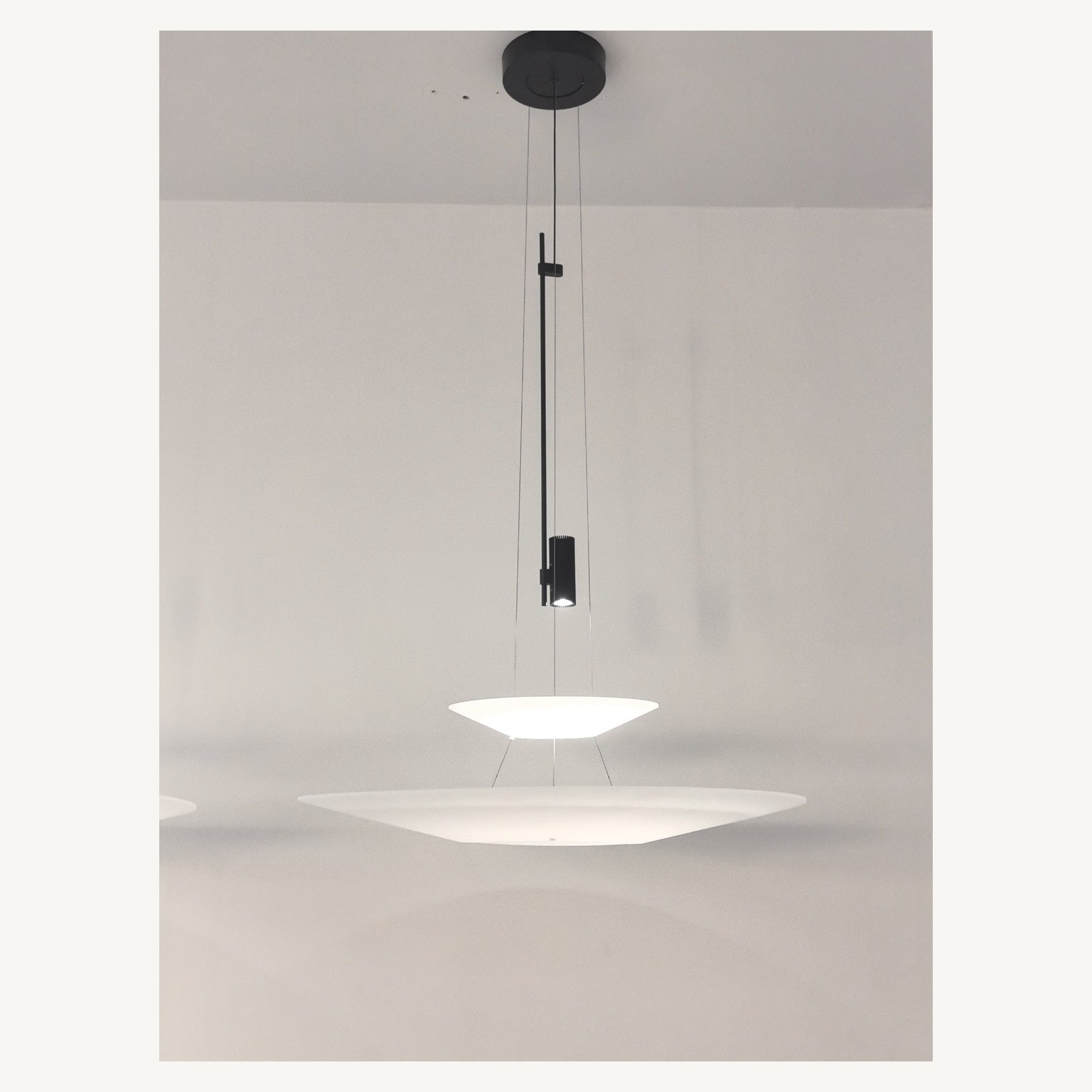 Supplier real photograph of the complete two-tier layered acrylic disc pendant from a second angle